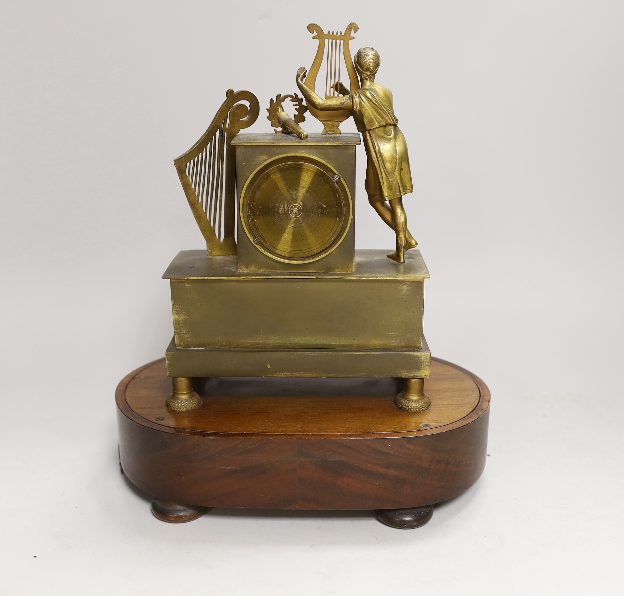 A 19th century French musical mantel timepiece, the dial inscribed Albert A Paris, the mahogany base with music box movement, 29cm high
